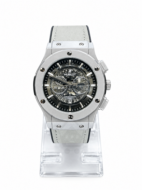 Men's silver skeleton chronograph watch with white leather strap