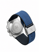 Men's silver skeleton chronograph watch with blue leather-style strap, black open-style dial and silver-tone case