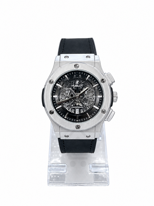 Men's silver skeleton chronograph watch with black leather-style strap, black open-style dial and silver-tone case