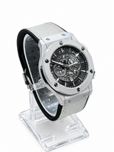 Men's silver skeleton chronograph watch with white leather strap