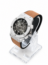 Men's silver skeleton chronograph watch with brown leather strap
